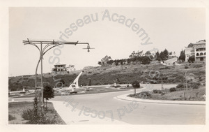 Image of Light standard without vines; also large sundial, Ingleside Terraces