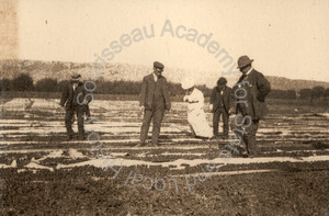 Image of Polhemus family members viewing fruit drying at Coyote Ranch