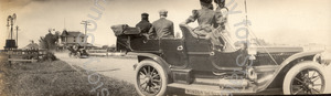 Image of Automobiles on the road outside the town of Warm Springs