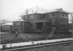 Image of Rear View of Stucco House for Sale