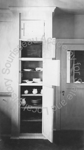 Image of Interior detail of a cupboard and cooler