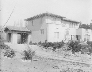 Image of Rear view of Wilson house with porte cochere and view of garden