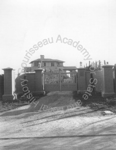 Image of Front gates of Wilson residence, with view of house behind them