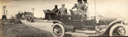 Image of Automobiles on the road outside the town of Warm Springs