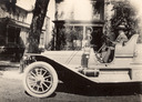 Image of Single touring car in front of house